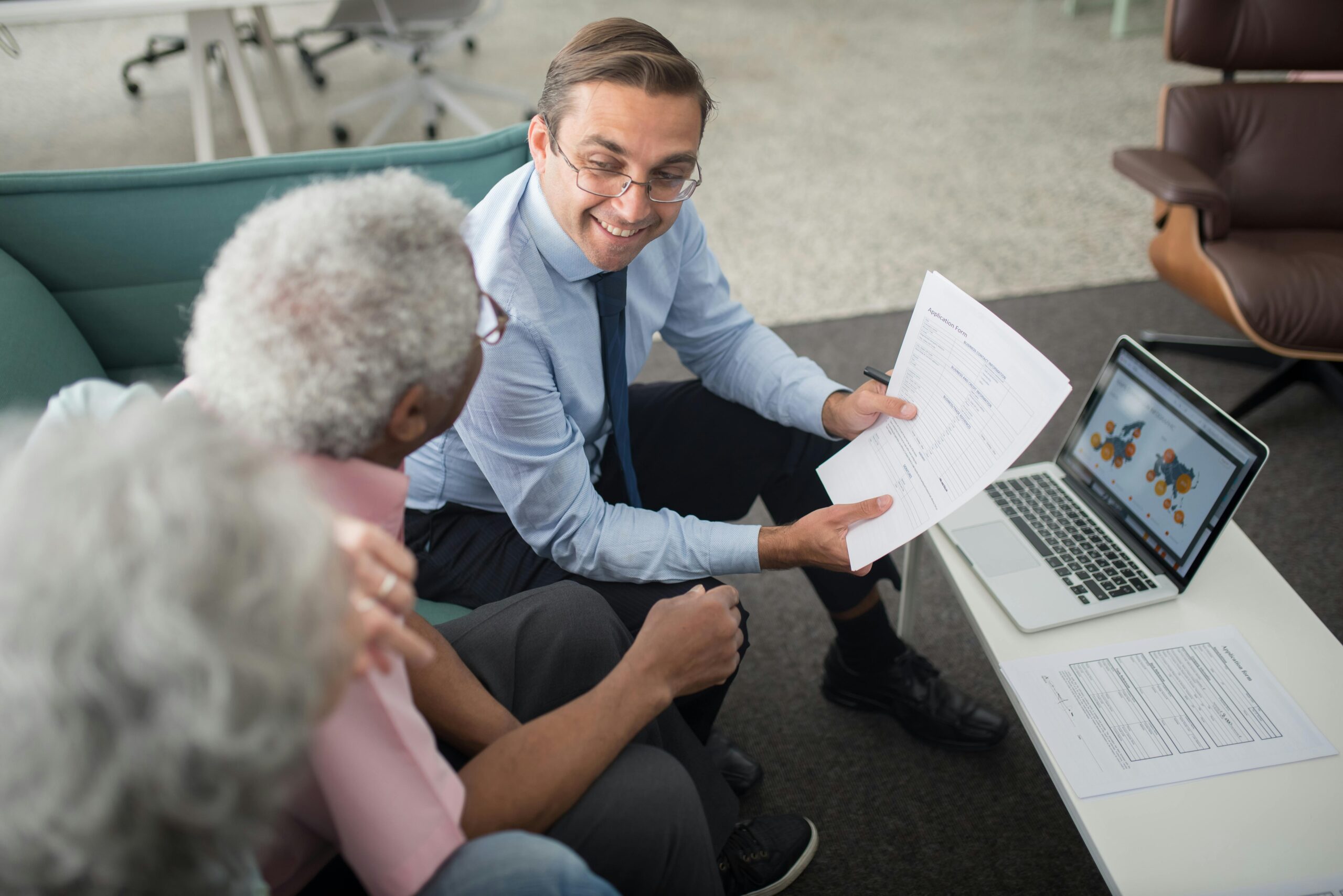 Advisor reviewing documents with a couple.