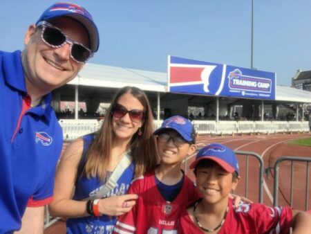 A family of four decked out in swag at the Bills Training Camp