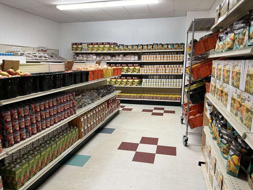 Shelves stocked with cans and boxes of food.