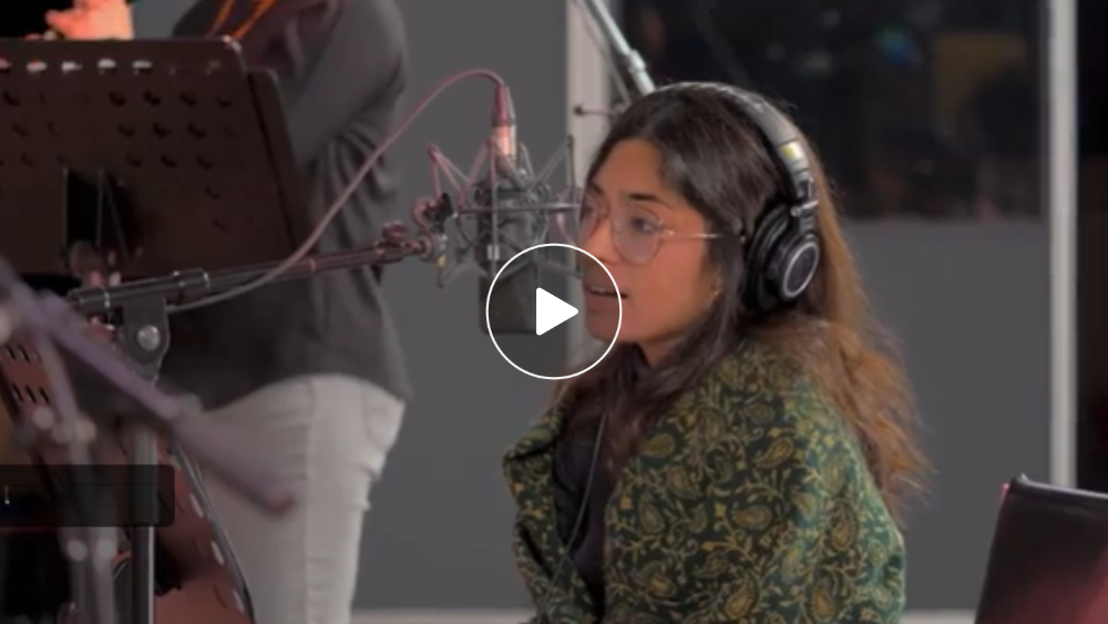 A woman in a recording studio