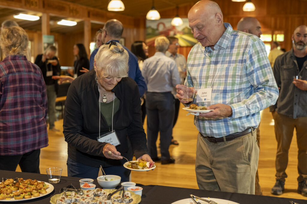 two individuals getting refreshments at Yates County endowment