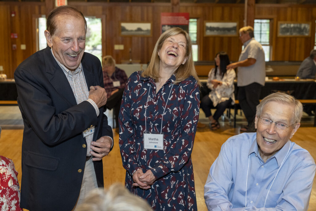 three individuals laughing at Yates County endowment event