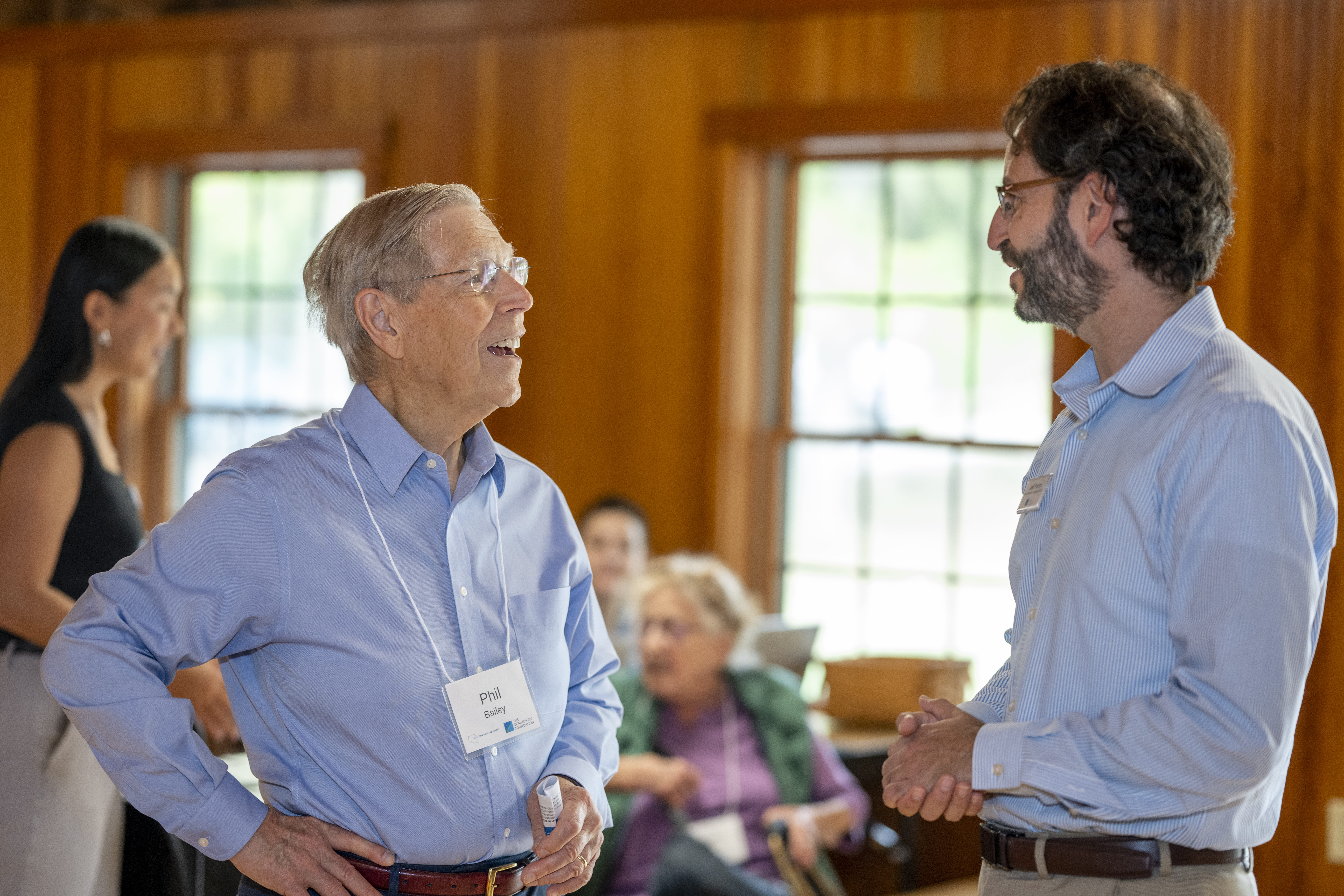 twoindividuals talking at Yates County endowment event