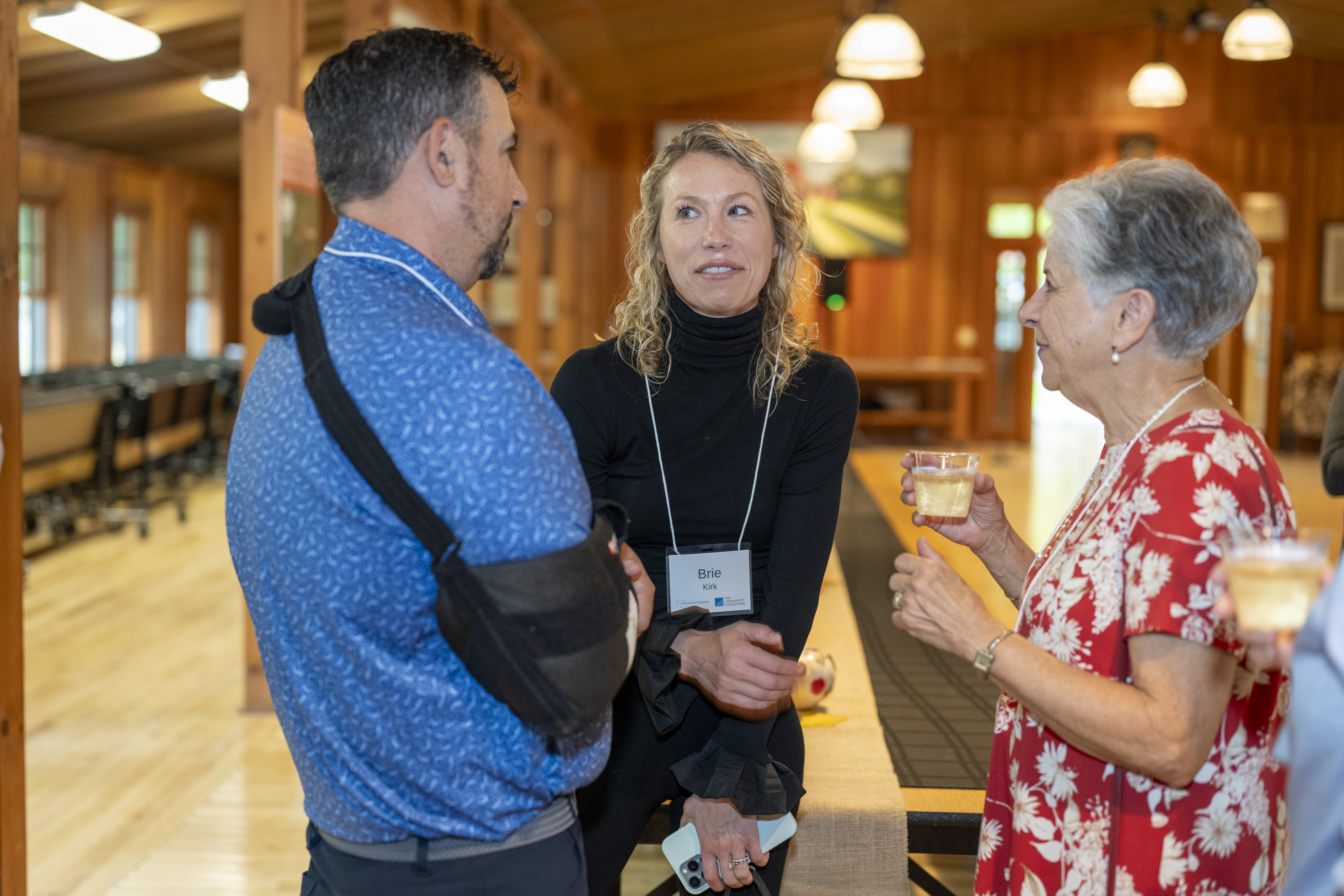 three individuals talking at Yates County endowment event