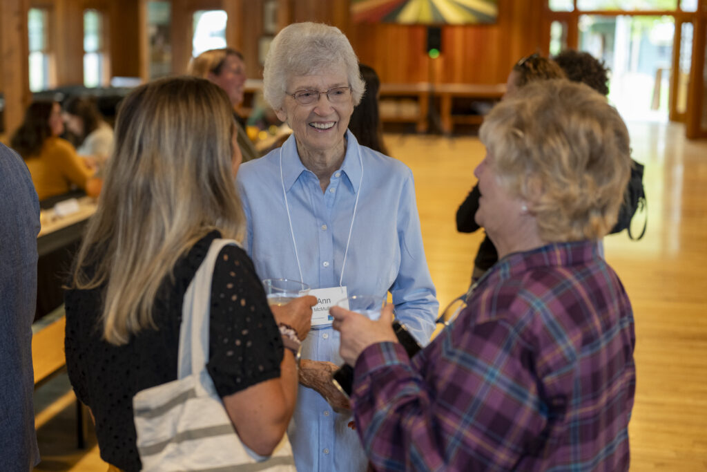 three individuals talking at Yates County endowment event