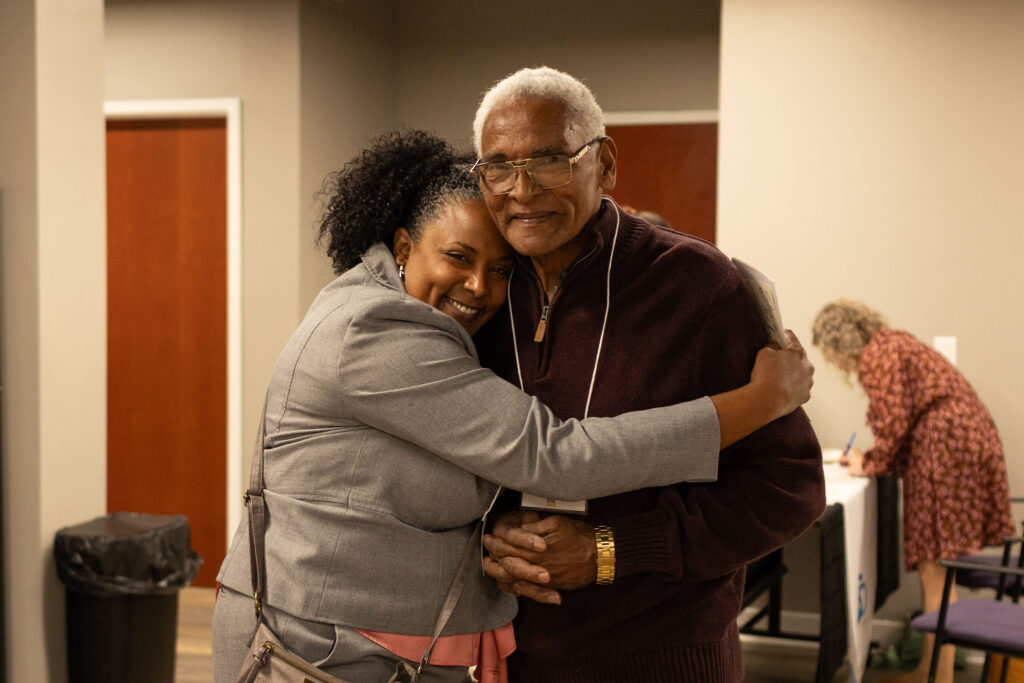 two people hugging at Latino Giving Circle grants reception