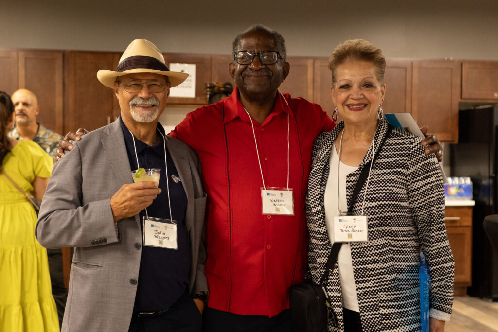 three people smiling at last year's Latino Giving Circle grant reception