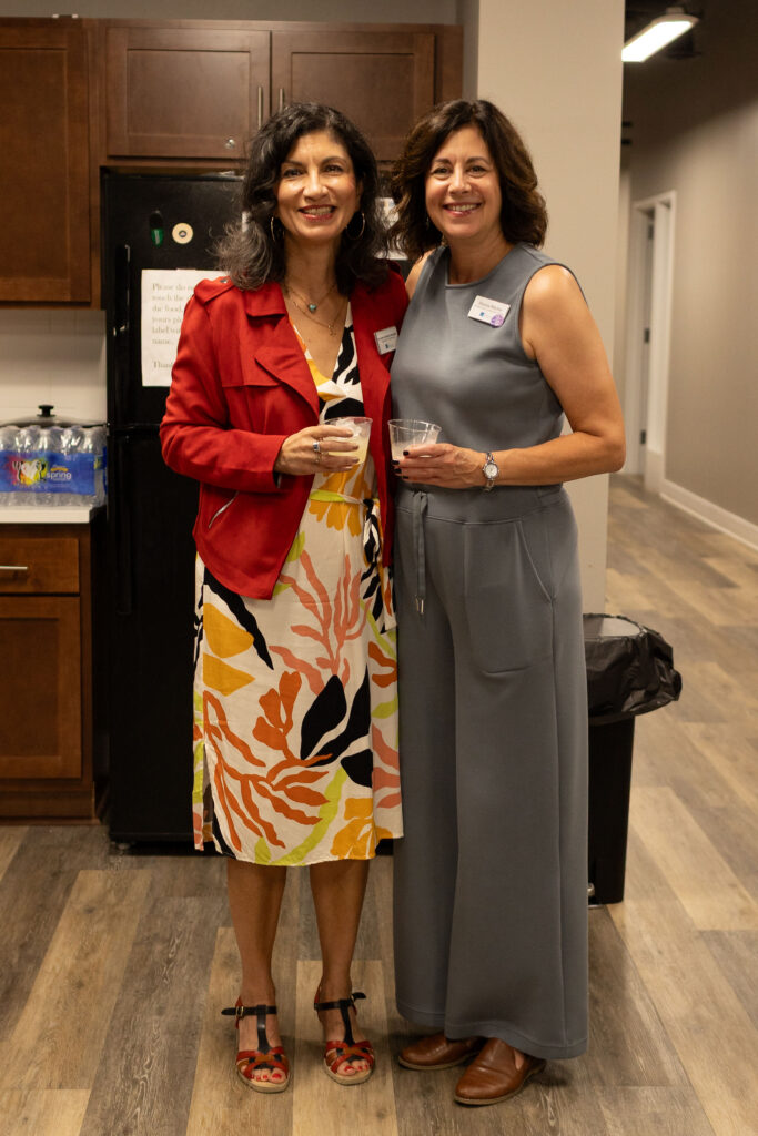 two people smiling at Latino Giving Circle grants reception