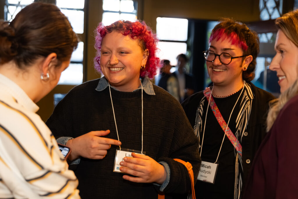 four youngers adults talking at LGBT+ Giving Circle event
