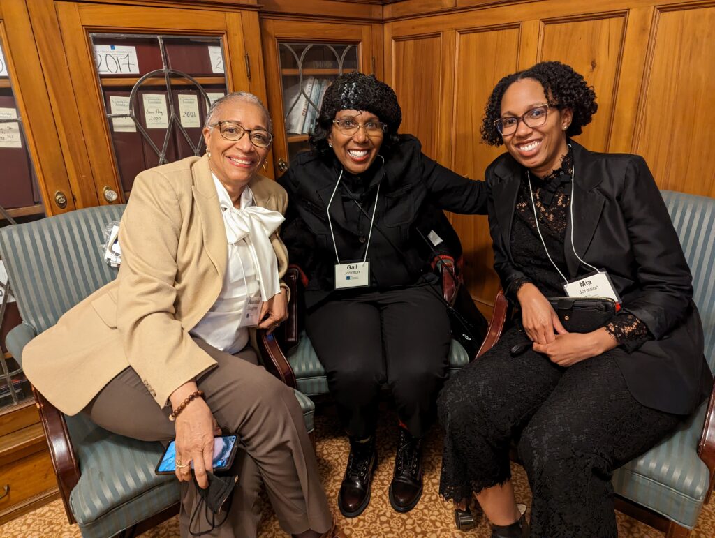 three people smiling at Black Giving Collective event