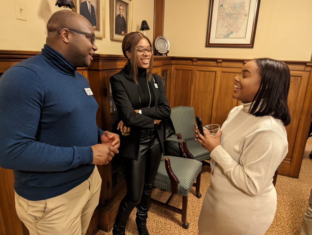 three people chatting at Black Giving Collective event