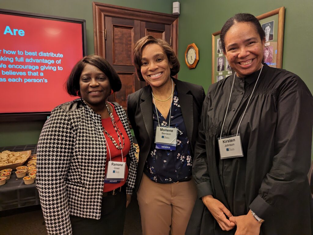 three smiling faces at Black Giving Collective event