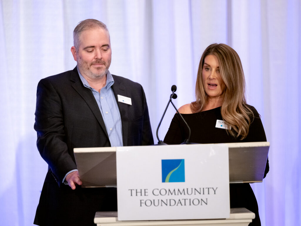 Erin and Andrew presenting at Celebration of Giving