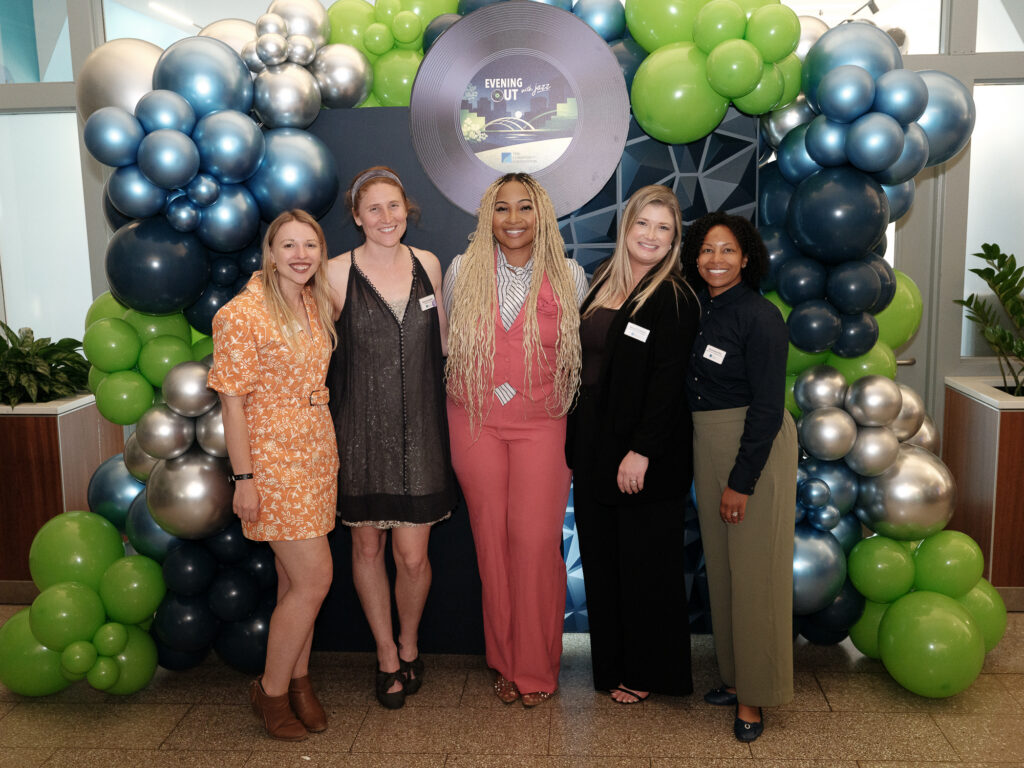 marComm team smiling at Evening Out with jazz