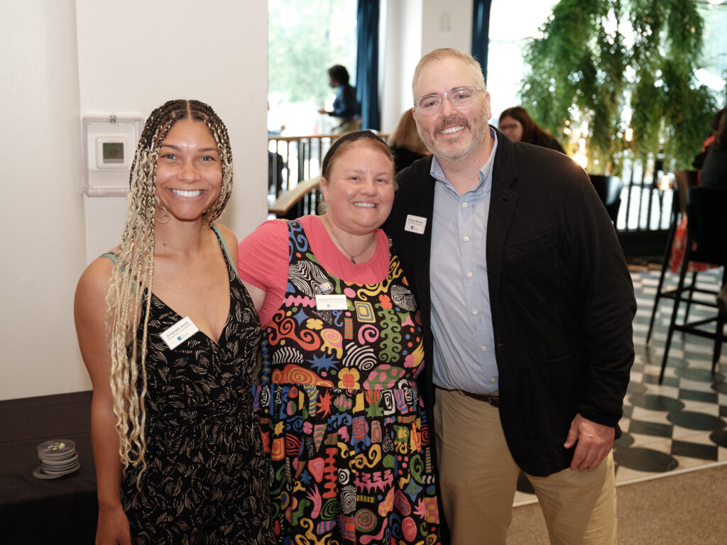 Amberlee, Andrew and Kayleigh smiling at evening out with Jazz