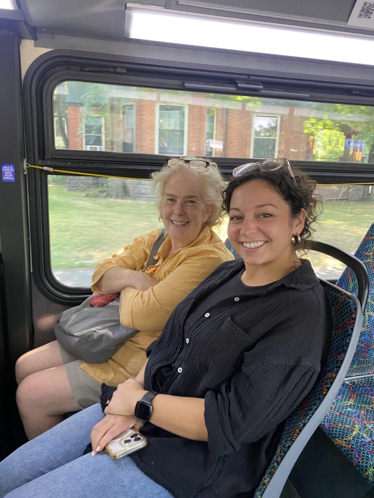 Miranda and Elizabeth at Reconnect Rochester ride a bus event